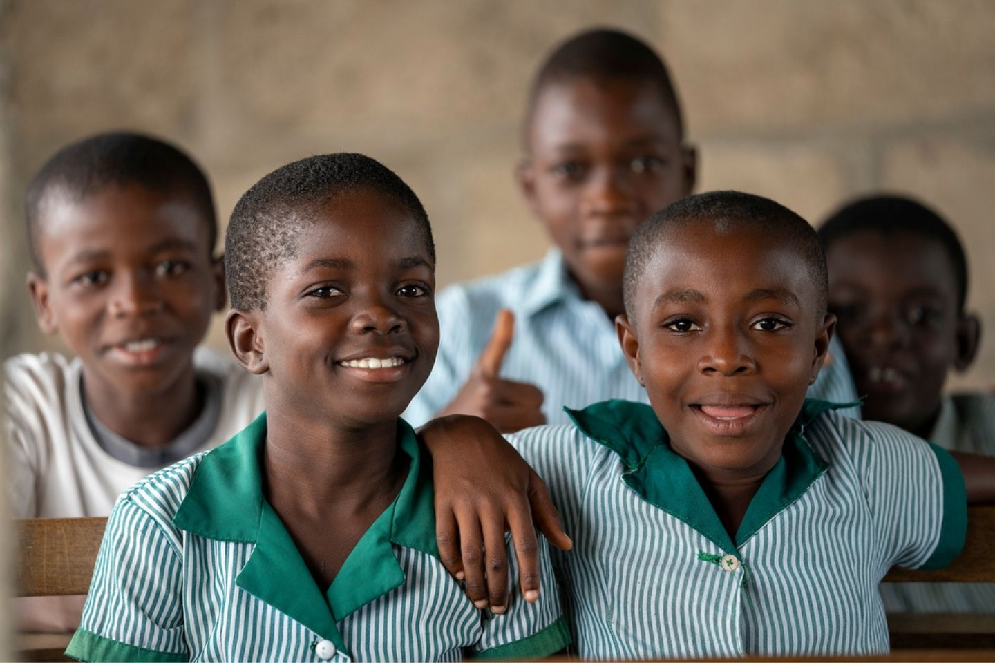 Stock image of two female students in Ghana looking at the camera