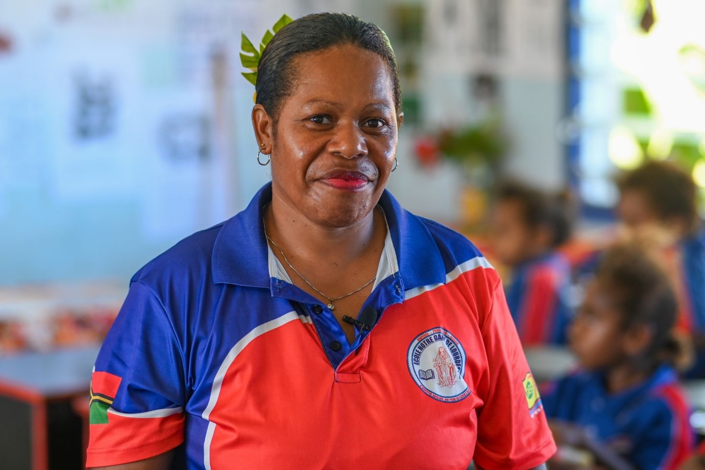 Grade 1 teacher from Vanuatu smiles at the camera